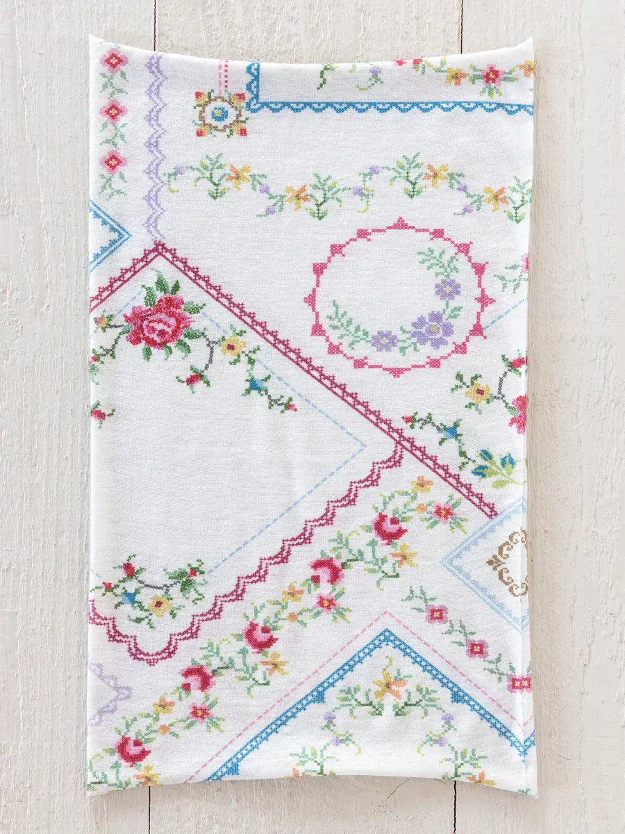 White embroidered boho bandeau headband with colorful floral heirloom cross stitch on ivory fabric