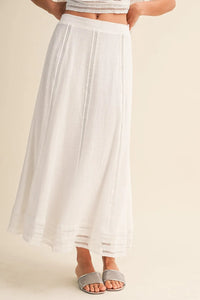 White lace trim cotton maxi skirt with delicate vertical lace detailing along the sides