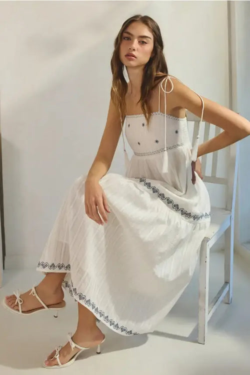 White embroidered tassel maxi dress with black star trim