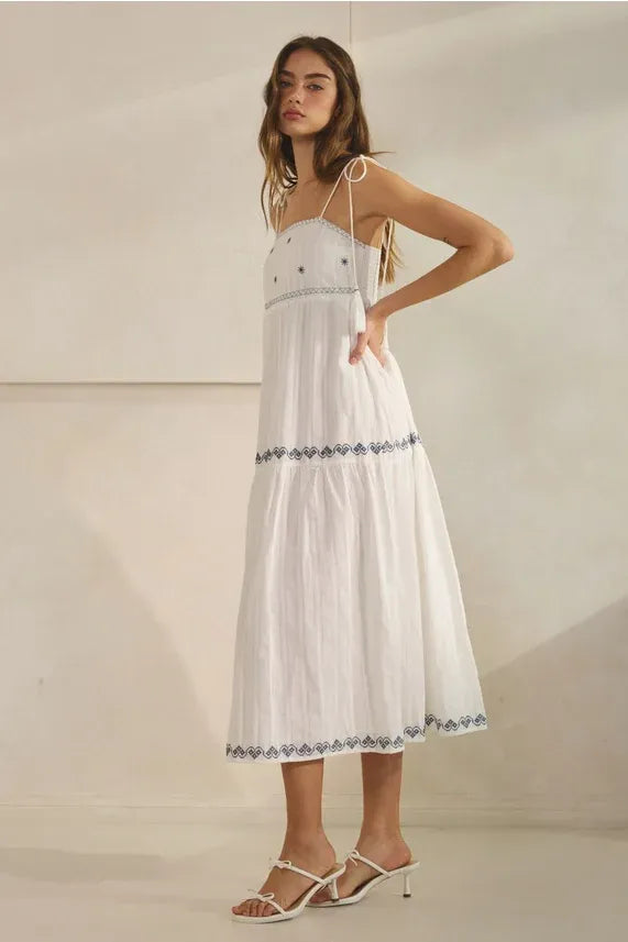 White embroidered tassel maxi dress with black pattern detailing