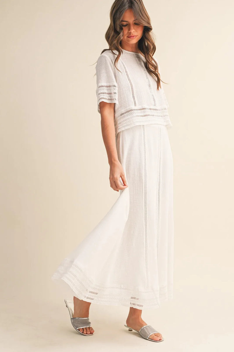 White embroidered two-piece summer outfit featuring lace trim cotton maxi skirt with delicate lace detailing on top