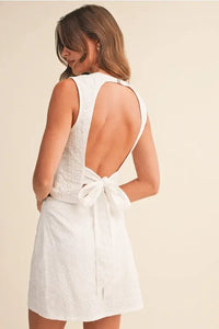 Back view of eyelet open tie back sleeveless top in white