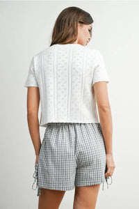 White eyelet pointelle knit short-sleeved crop top with scalloped tie front for women’s boho chic clothing