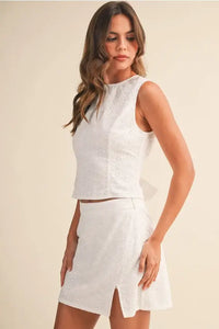 Eyelet open tie back sleeveless top with matching mini skirt