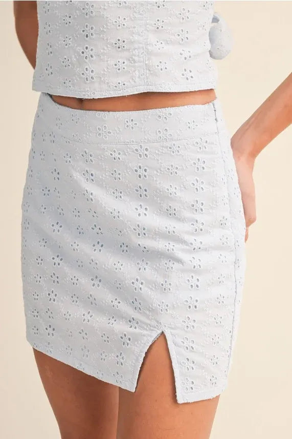 White eyelet slit mini skort with floral pattern and side slit