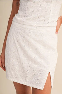 White eyelet slit mini skort with floral pattern and side slit