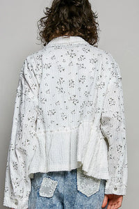 White cotton floral ruffle detailing shacket with front patch pockets and ruffled hem for stylish layering