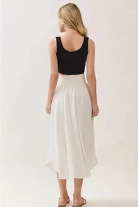 Smocked waistband lined rounded hem midi skirt, white asymmetrical flow