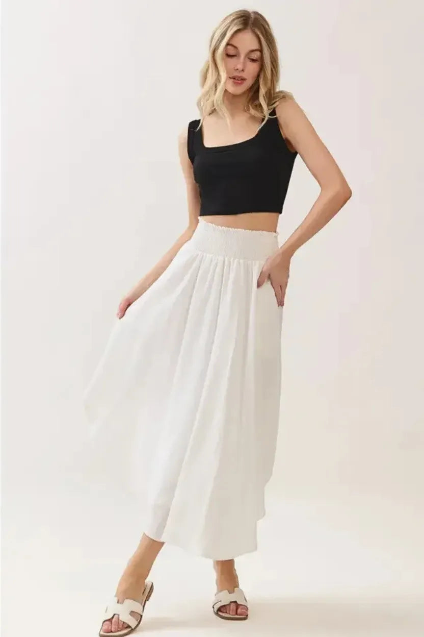 White smocked waistband lined rounded hem midi skirt, pleated design