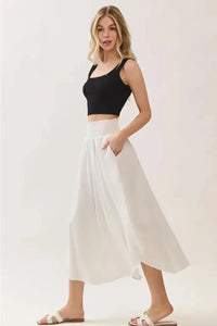 White smocked waistband lined rounded hem midi skirt, flowing with side slits