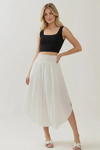 White smocked waistband lined midi skirt with pleated asymmetrical hem