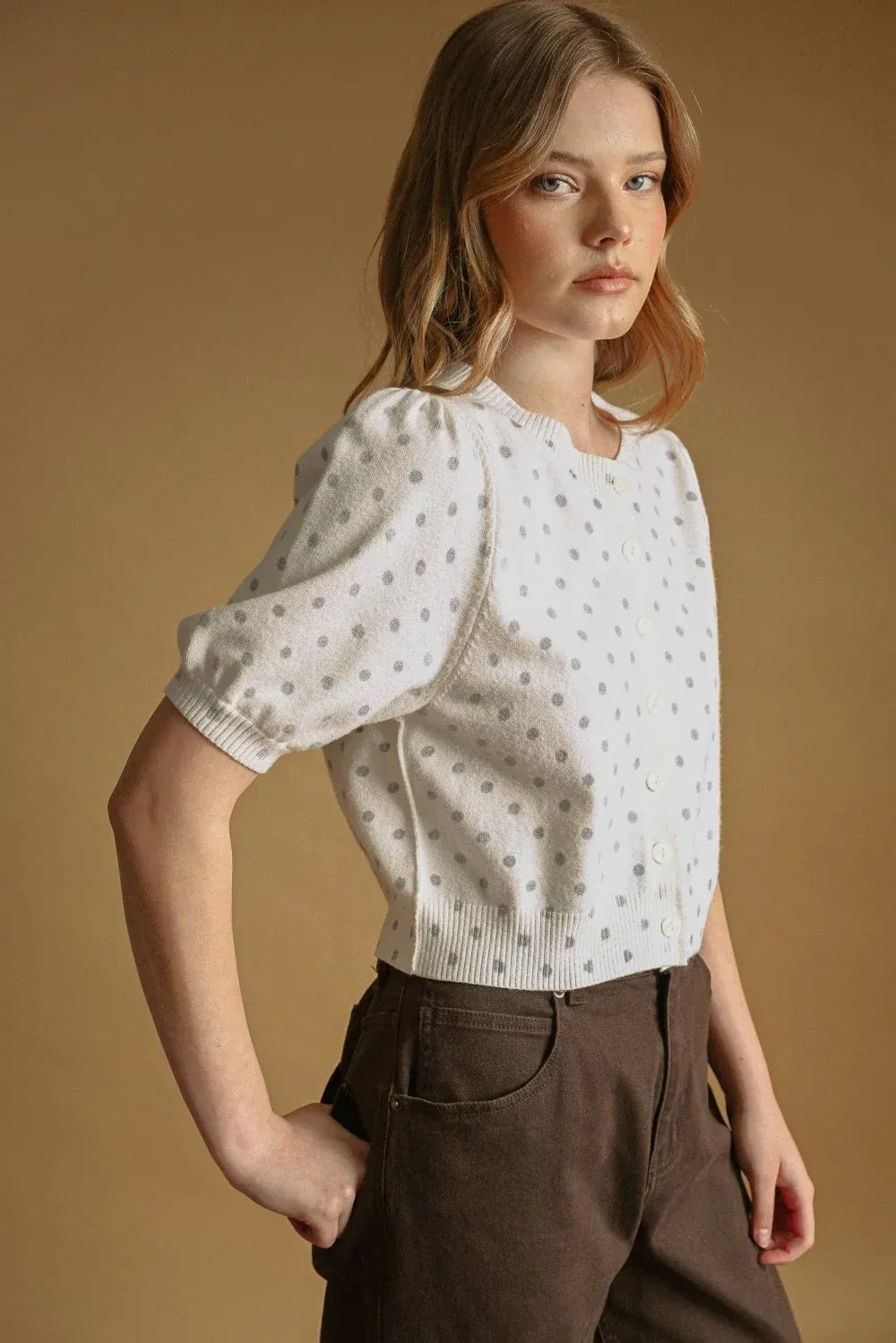 White knit polka dot short sleeve cardigan with silver dots and puffed sleeves for stylish layering