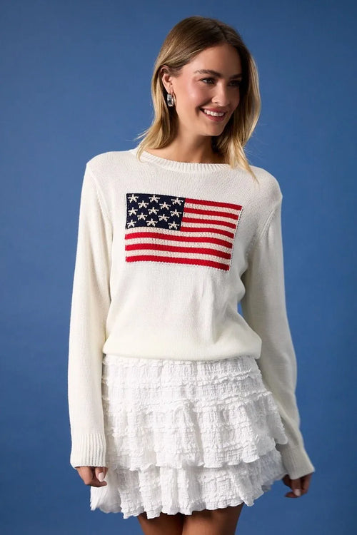 White knit round neck sweater top with detailed red white and blue flag print design for casual wear