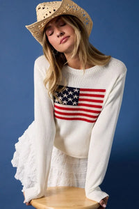White knit round neck flag print sweater top with red white and blue American flag patch on the chest