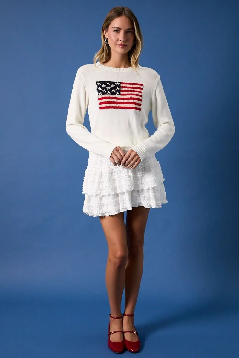 White knit round neck sweater top featuring embroidered american flag print on the chest for casual wear