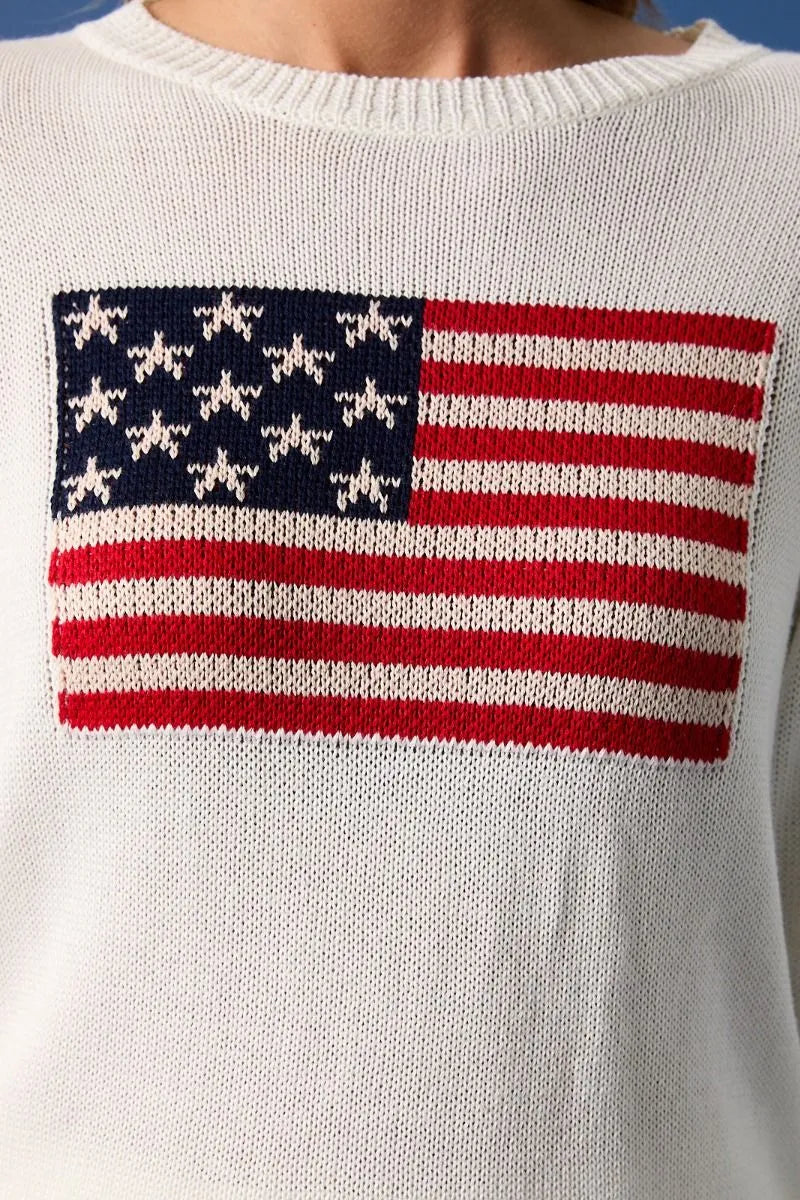 White knit round neck flag print sweater top featuring a knitted american flag design with red white and navy blue stripes
