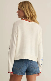 White knit day sienna sweater with red and blue star embroidery on sleeves and neckline trim