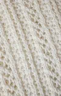 White knitted ballast crochet sweater top featuring a delicate openwork pattern in soft crochet fabric