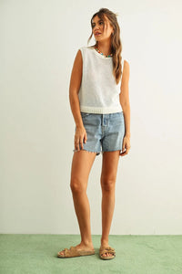 White sleeveless round neck knitted top with ribbed hem and neckline made from soft knit fabric