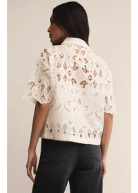 White lace midnight embroidered short sleeve top with puffed sleeves and delicate geometric pattern