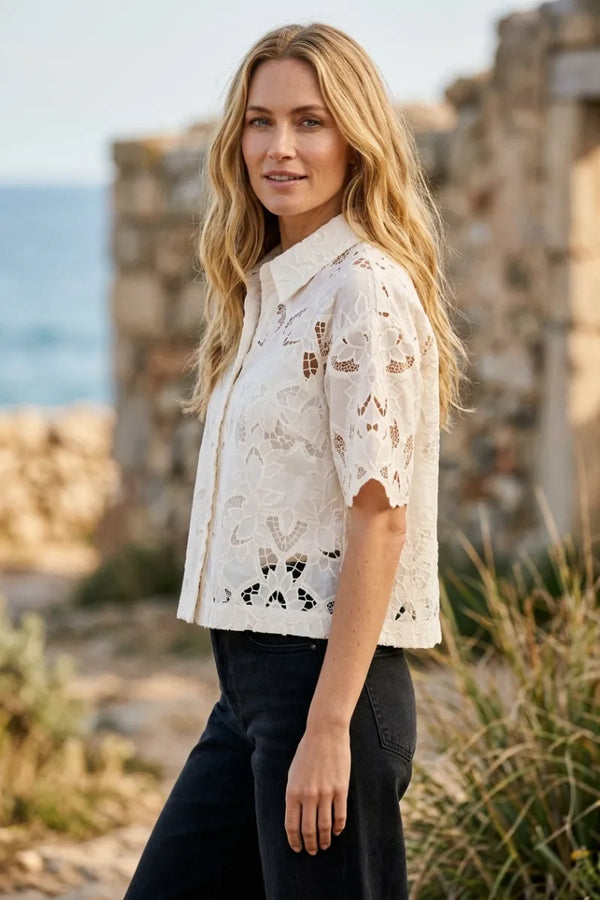 White lace midnight embroidered short sleeve top with collar and intricate cut-out patterns