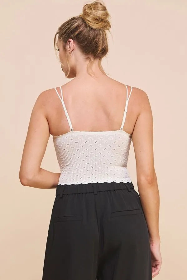 White lace bralette cami with laser cut scallop edge and delicate pattern featuring thin straps