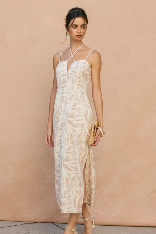 White lace midi dress with tropical leaf pattern and thin spaghetti straps featuring a leaf v cut design