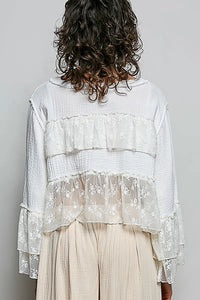 A white lace ruffle blouse with round neck flared sleeves made of lightweight double gauze fabric