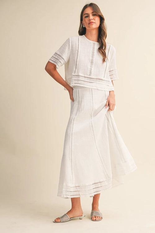 White lace trim cotton blouse with delicate embroidered detailing paired with matching high waisted skirt