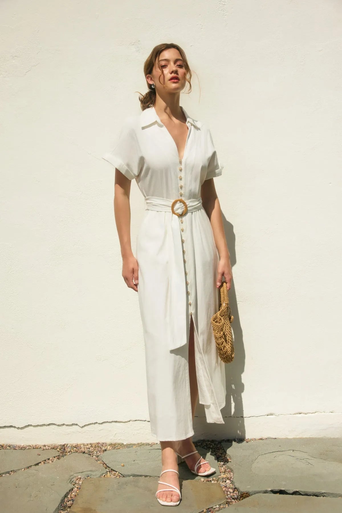 White linen shirt dress with button front and gold-toned circular wicker buckle maxi belt buckle maxi dress