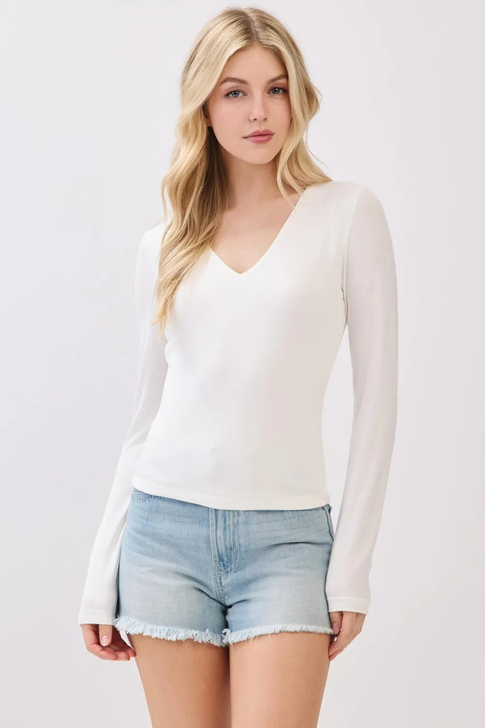 White double layer v neck long sleeve basic top with sheer fabric for elegant layering and comfort