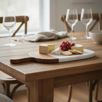 Elegant white marble cheese board with dark wood handle