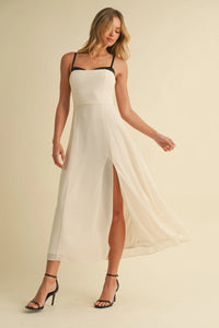 White sweetheart neckline contrast straps midi dress with black spaghetti straps and high slit in lightweight fabric