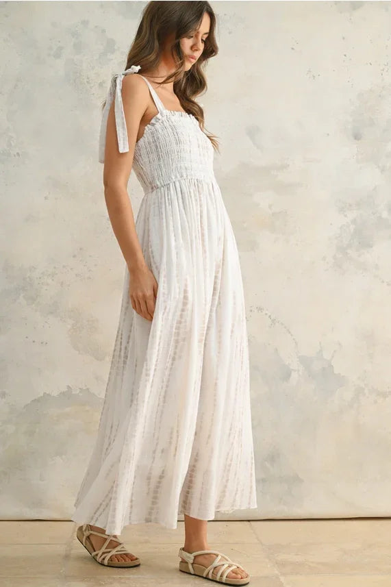 Flowing white women’s maxi dress with tie-sleeve straps and gathered bodice
