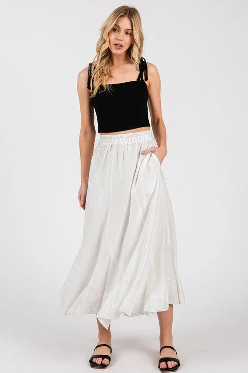 Disjoint maxi length skirt: white flowing maxi with elastic waistband, side pockets