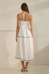 White embroidered tassel maxi dress with blue trim on waist and hem