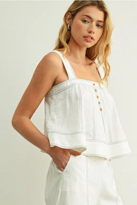 White stitch detailed sleeveless top with off-the-shoulder thin straps gold buttons and navy blue piping accents