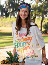 White oversized t-shirt with rainbow hand-painted text paired with full boho bandeau headband in block stamp indigo