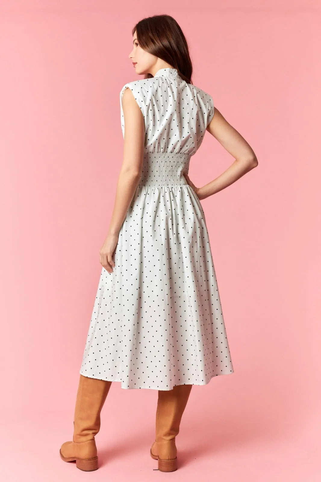 White pin polka dot flare midi dress with v-neck zip-up and smocked waist sleeveless design