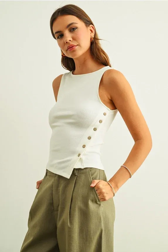 White ribbed sleeveless top with a diagonal ribbed button row and ribbed texture for women’s boho chic clothing