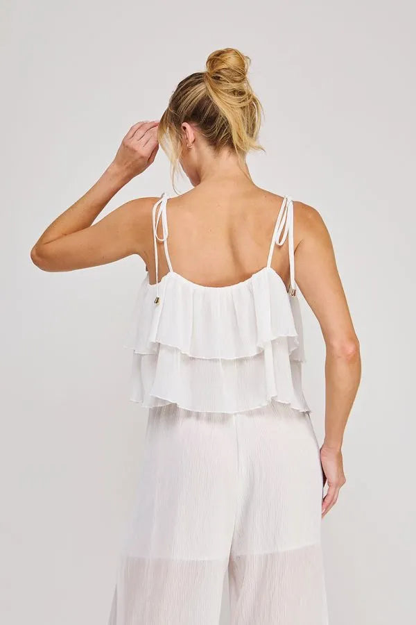 White textured woven tie strap ruffle camisole top with thin adjustable straps and gold-tone hardware accents