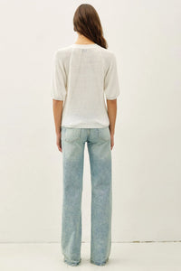 White lightweight ribbed knit raglan short sleeve top with subtle texture and delicate beaded detailing on back side