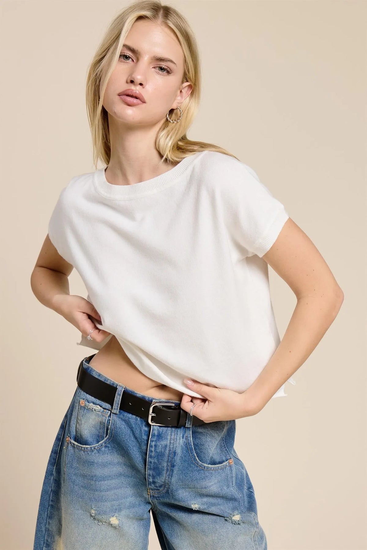 White lightweight knit short sleeve tee with loose fit and rounded neckline for casual wear