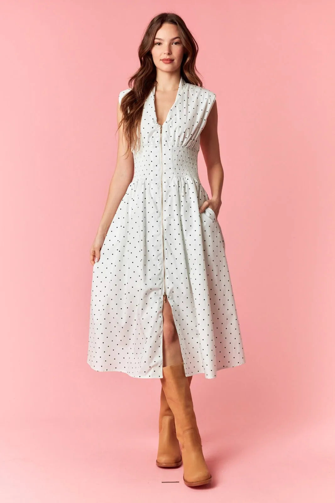 A white sleeveless flare midi dress with pin polka dot pattern and a dot v-neck zip-up front slit design
