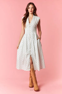 A white sleeveless flare midi dress with pin polka dot pattern and a dot v-neck zip-up front slit design