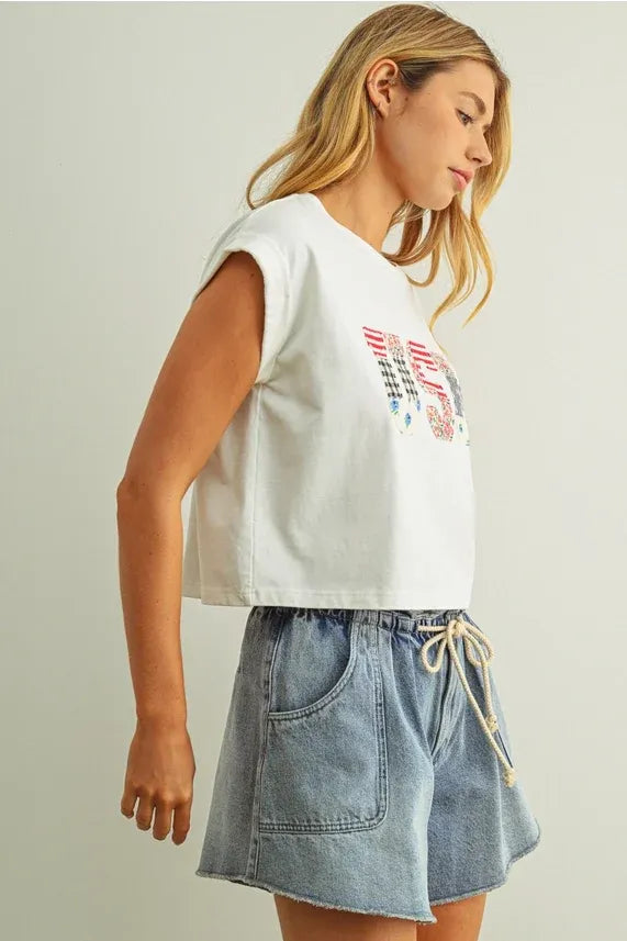 White sleeveless cropped top with usa floral patchwork embroidered graphic on the chest perfect for casual wear