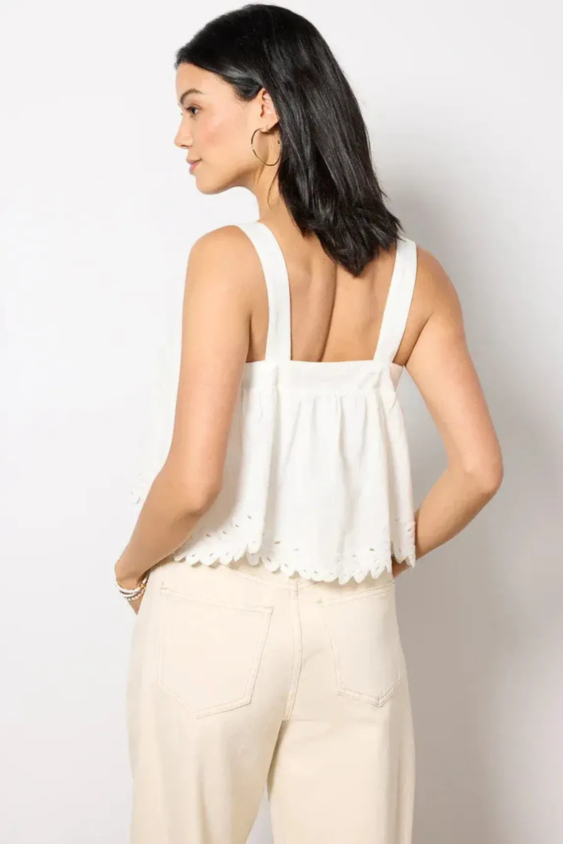 White sleeveless top with delicate scalloped hem featuring square neck adjustable straps and built-in bra for comfort