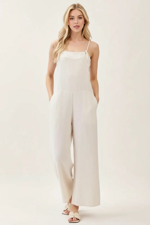 Spaghetti strap wide leg jumpsuit with flowing white wide-leg pants