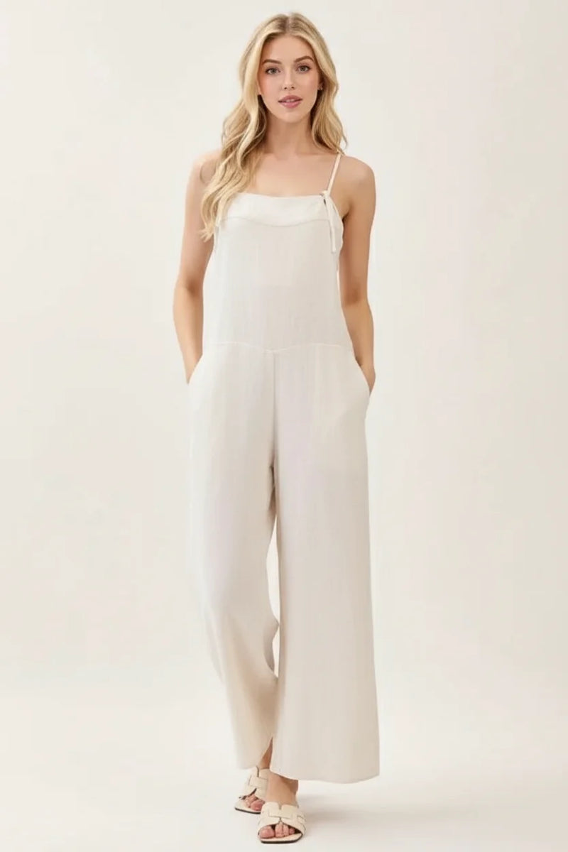 Spaghetti strap wide leg jumpsuit with flowing white wide-leg pants