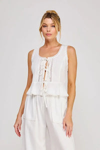 White sleeveless linen blend top with front ties lace trim detail perfect for women’s boho chic clothing